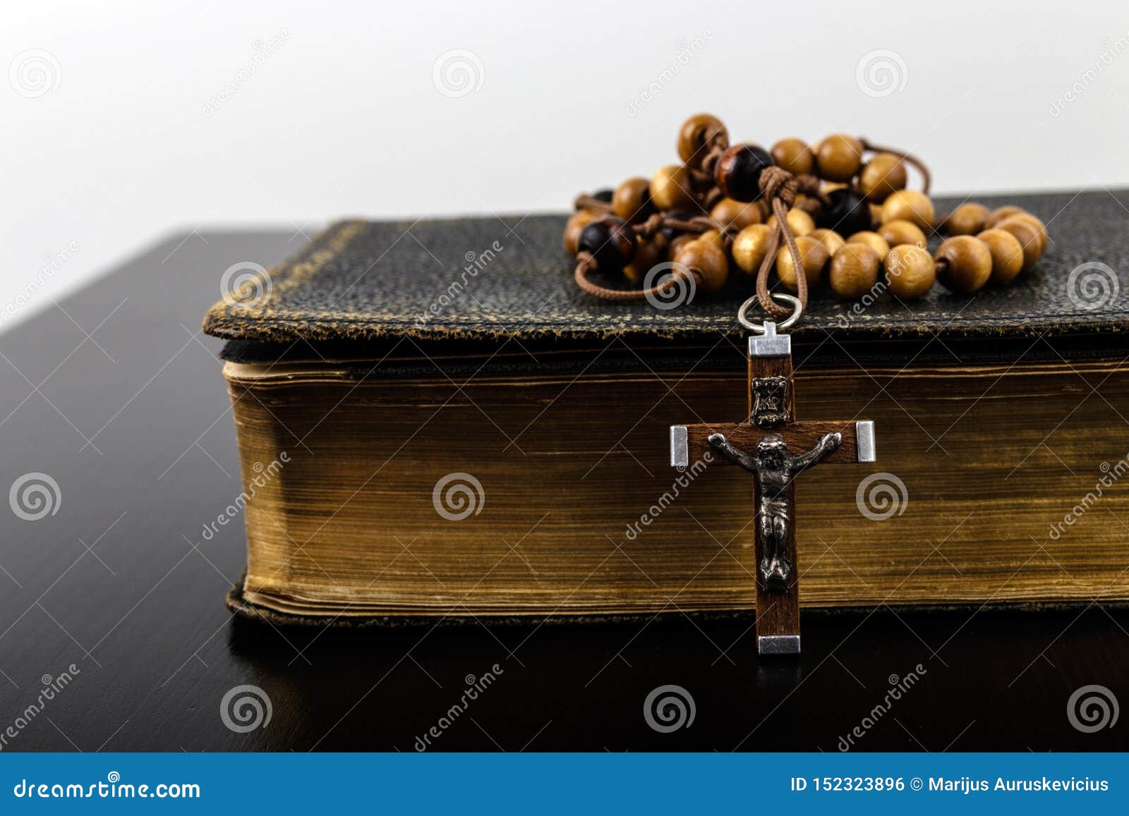 rosary beads and prayer book