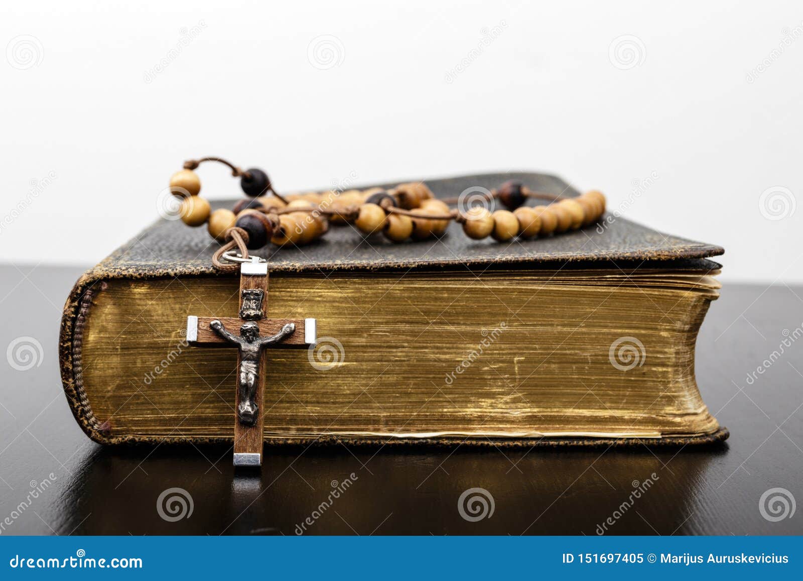 rosary beads and prayer book