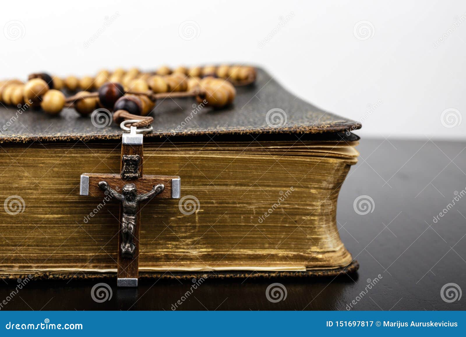 rosary beads and prayer book