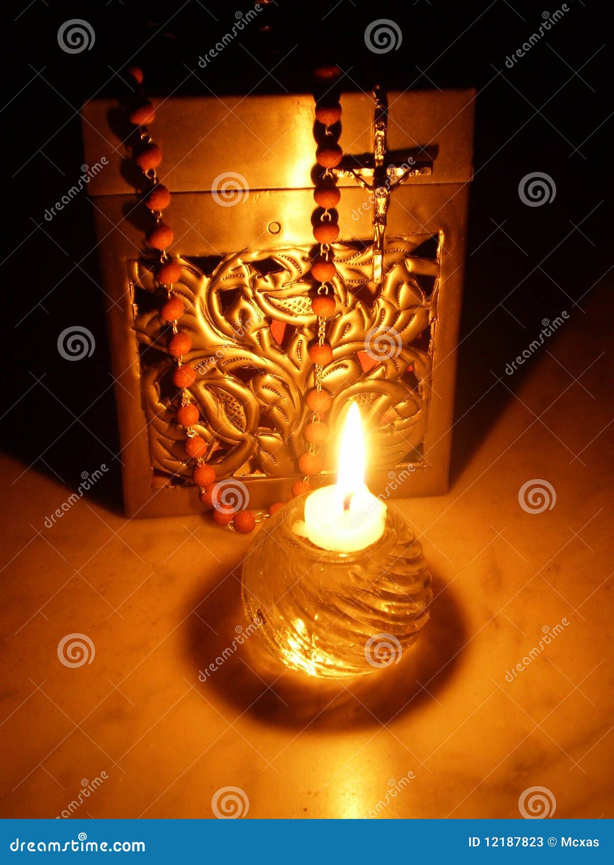 Rosary, box and a candle stock image. Image of crucifix 12187823