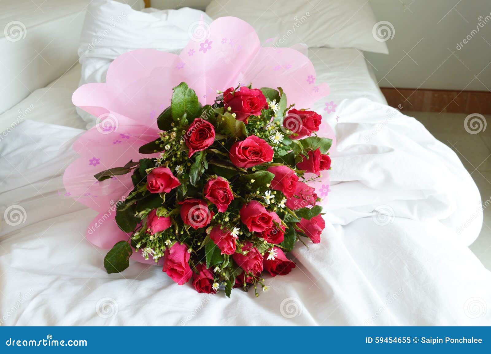 Rose bouquet on bed stock image. Image of bouquet, romantic 59454655