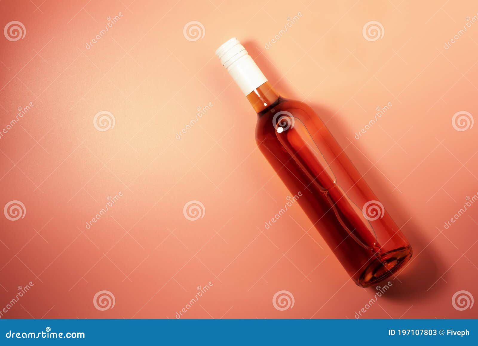rose wine bottle on pink bakcground. rosado, rosato or blush wine tasting in wineshop, bar concept. copy space, top view