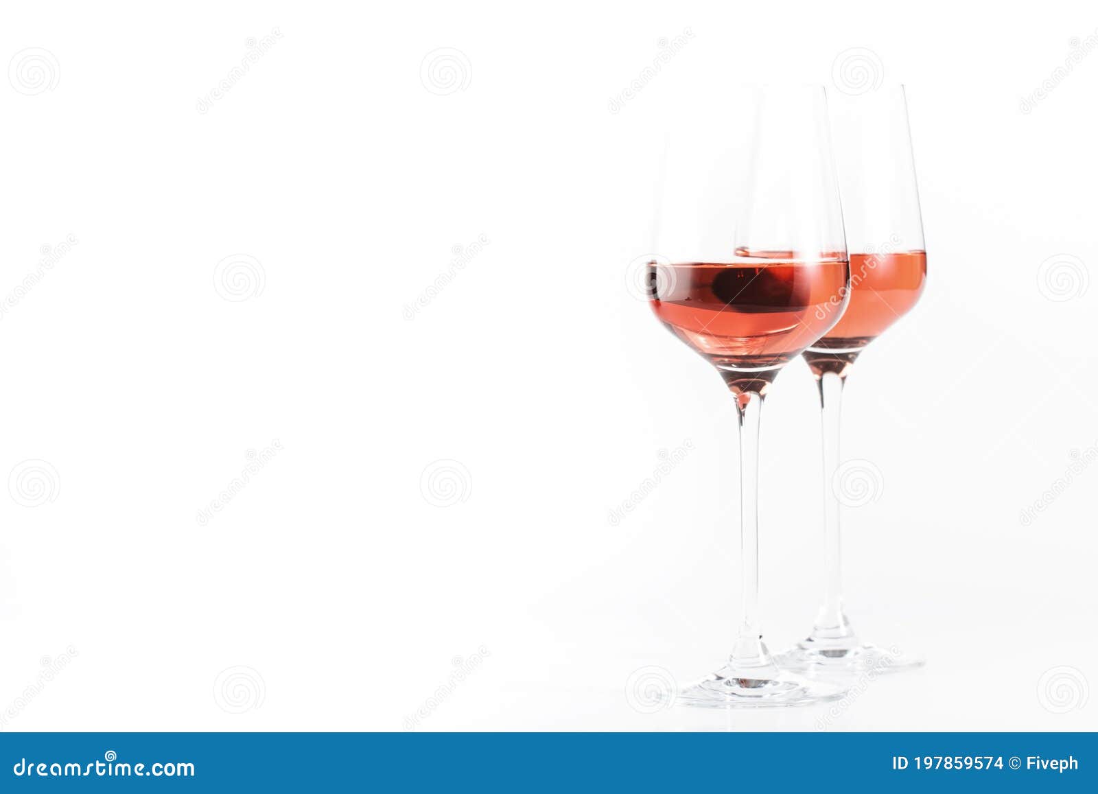 rose wine glass with bottle on the white table. rosado, rosato or blush wine tasting in wineshop, bar concept. copy space
