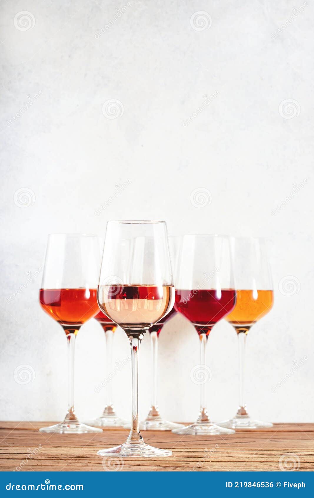 rose wine glasses set on wine tasting. different varieties, colors and shades of pink wines on white background