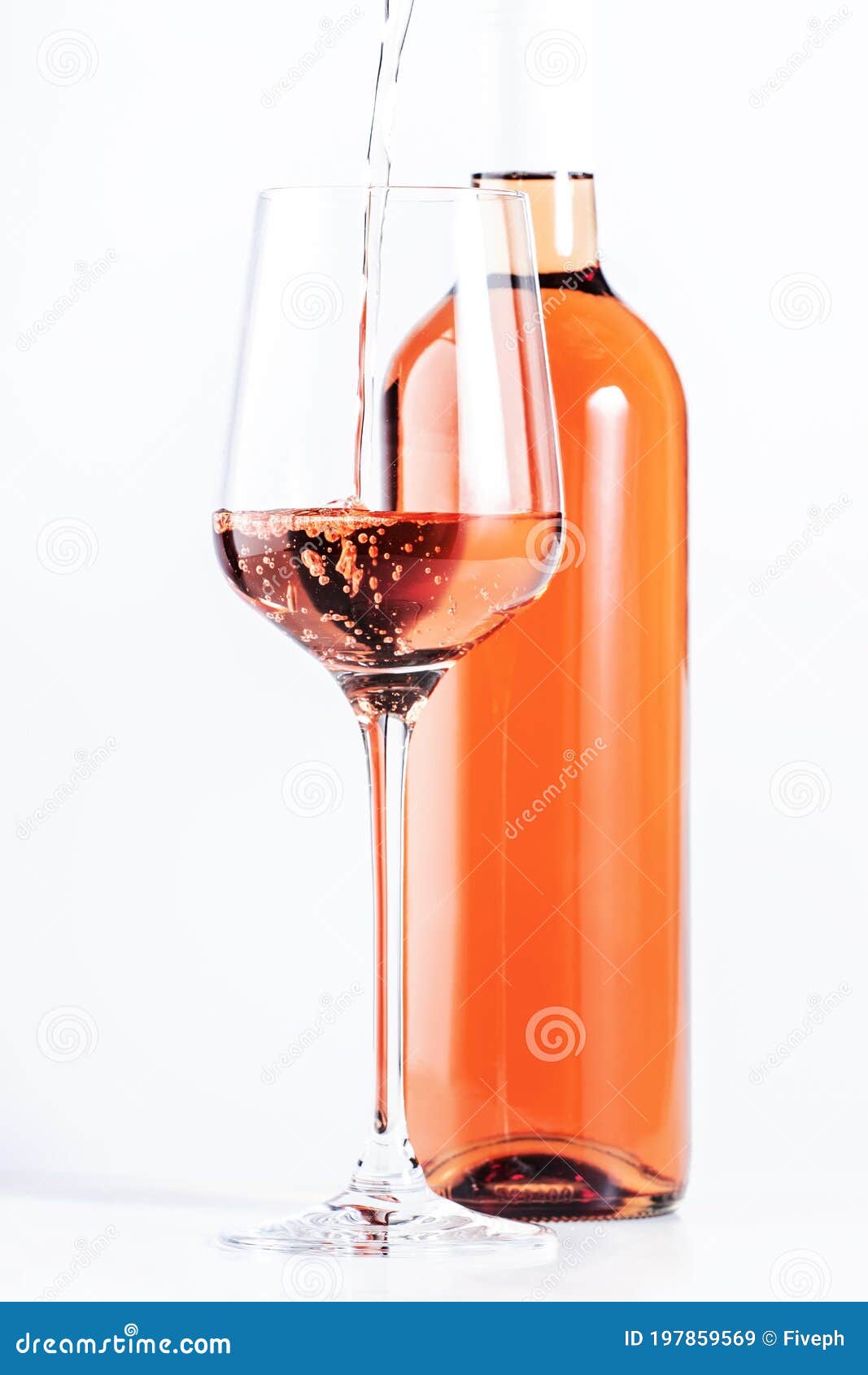 rose wine pouring out of the bottle, white background. rosado, rosato or blush wine tasting in wineshop, bar concept. copy space