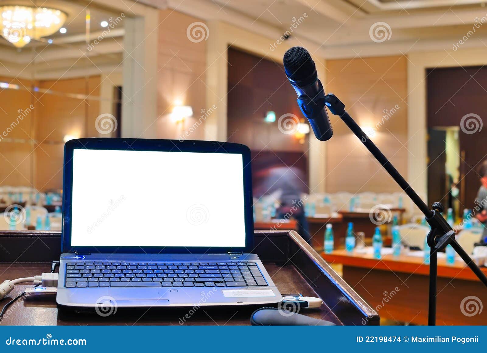 the rostrum with notebook waiting for a speaker