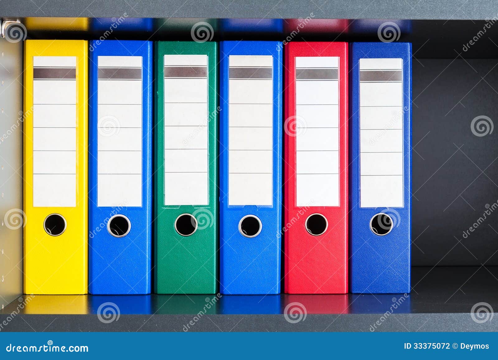 Rote, Grüne, Blaue Und Gelbe Büroordner Stockfoto - Bild von korporativ