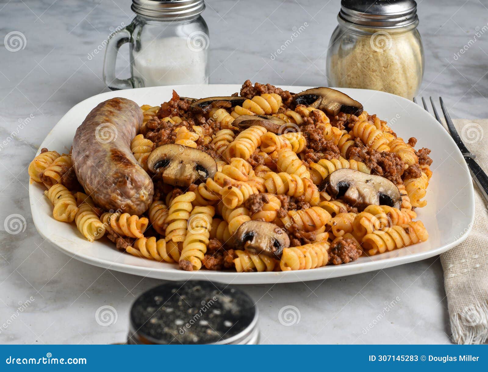 Rotini Pasta with a Meat Sauce and Mushrooms Stock Image - Image of