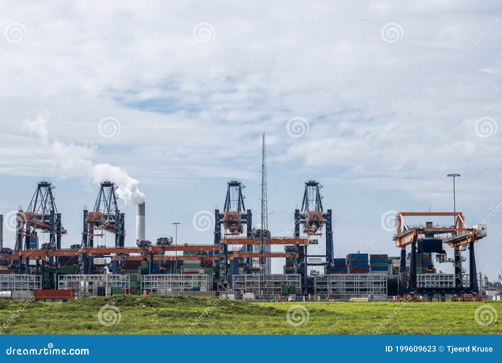 rotterdam, the netherlands container being loaded by gantry cranes in the maasvlakte in the port of rotterdam