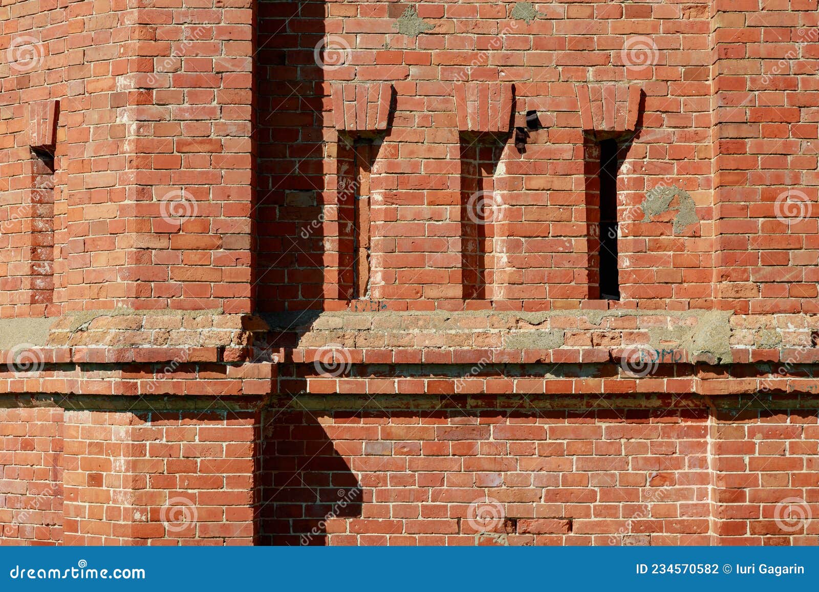 Rough Brick Wall with Architectural Elements. Textured Background. Blank for Design Stock Photo