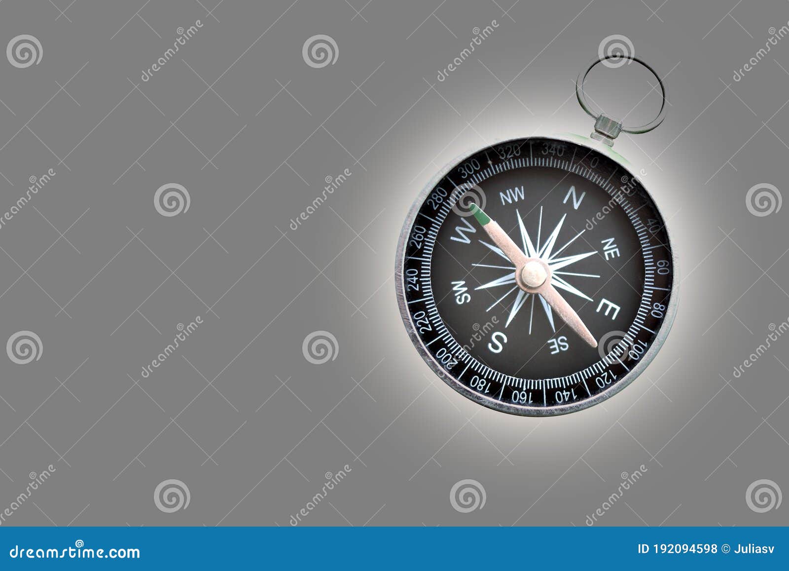 round compass on gray background as  of tourism with compass, travel with compass and outdoor activities with compa