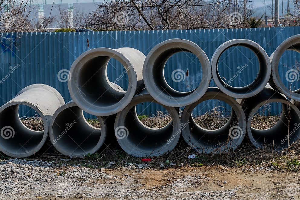 round-concrete-culverts-stacked-countryside-front-fence-214879213.jpg?w=992