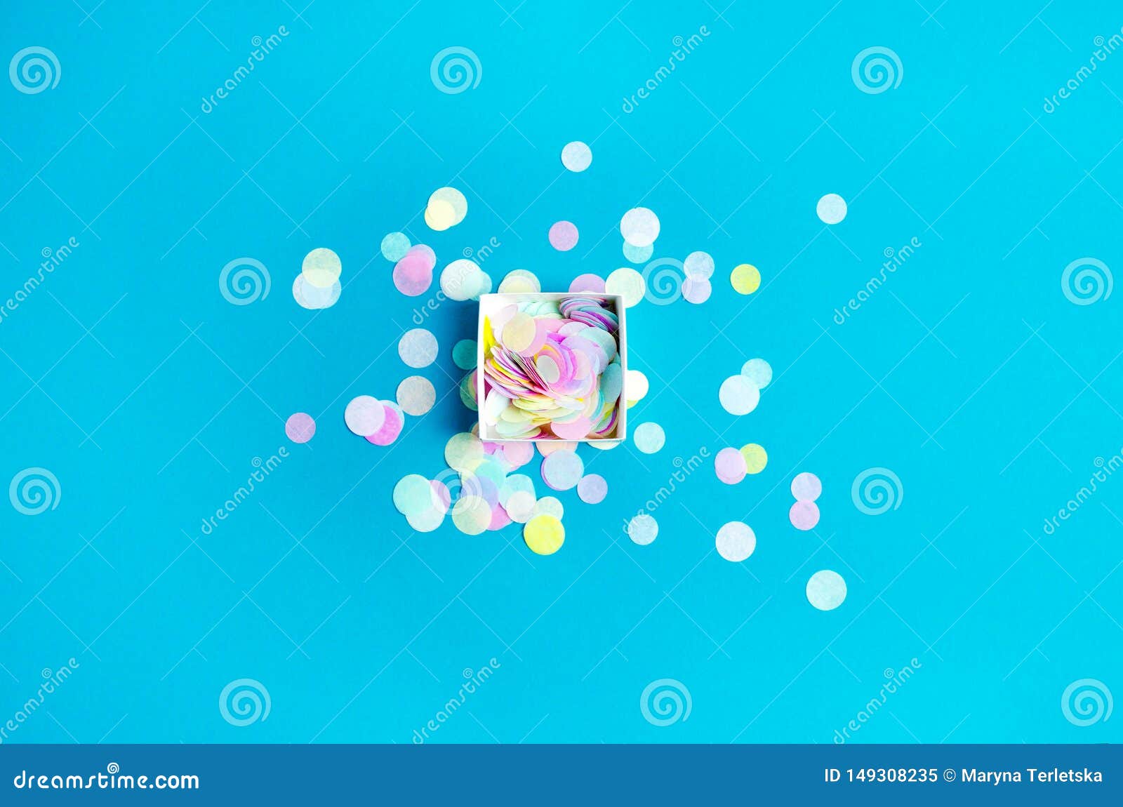 Round Confetti in a Square Box on a Turquoise Background Stock Image