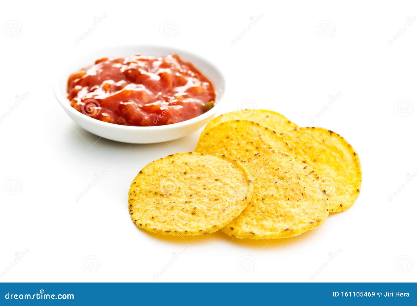 Round Corn Nacho Chips and Tomato Dip. Yellow Tortilla Chips and Salsa