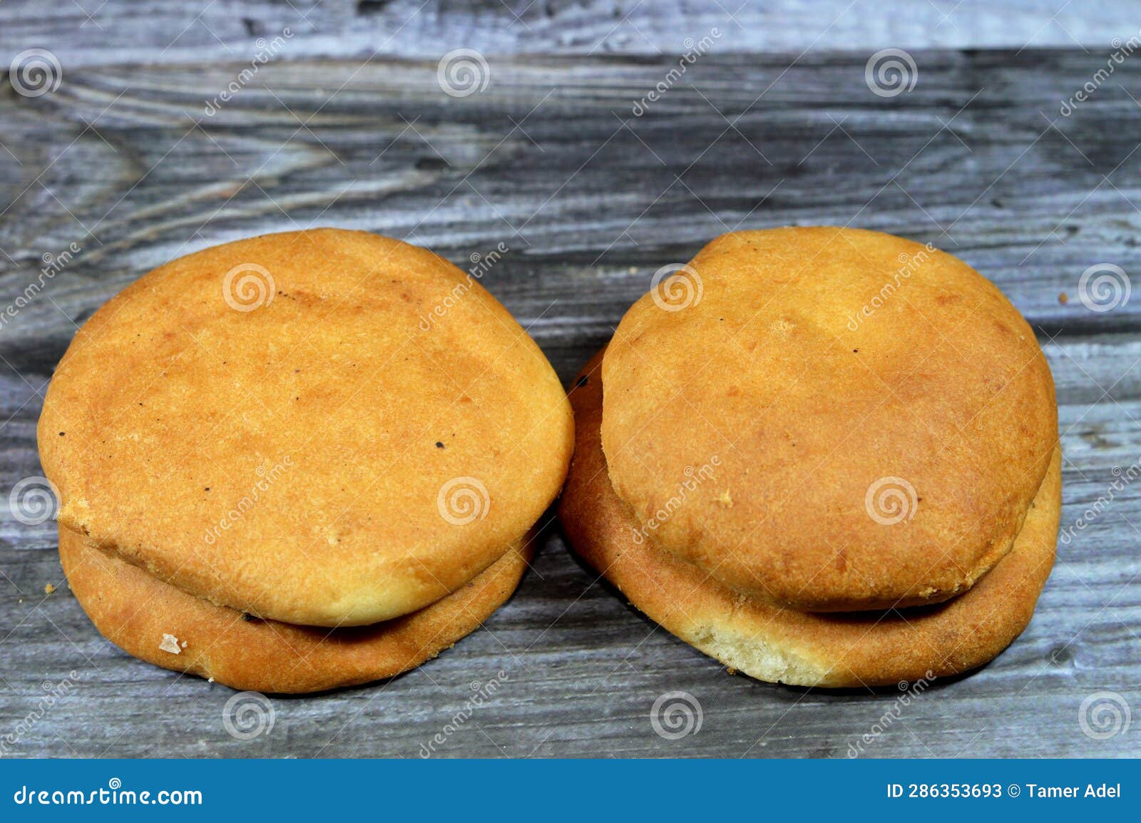 round egyptian pastries made of flour plain or stuffed with ajwa, agwa or pressed dates fruit, baked in the oven, usually served