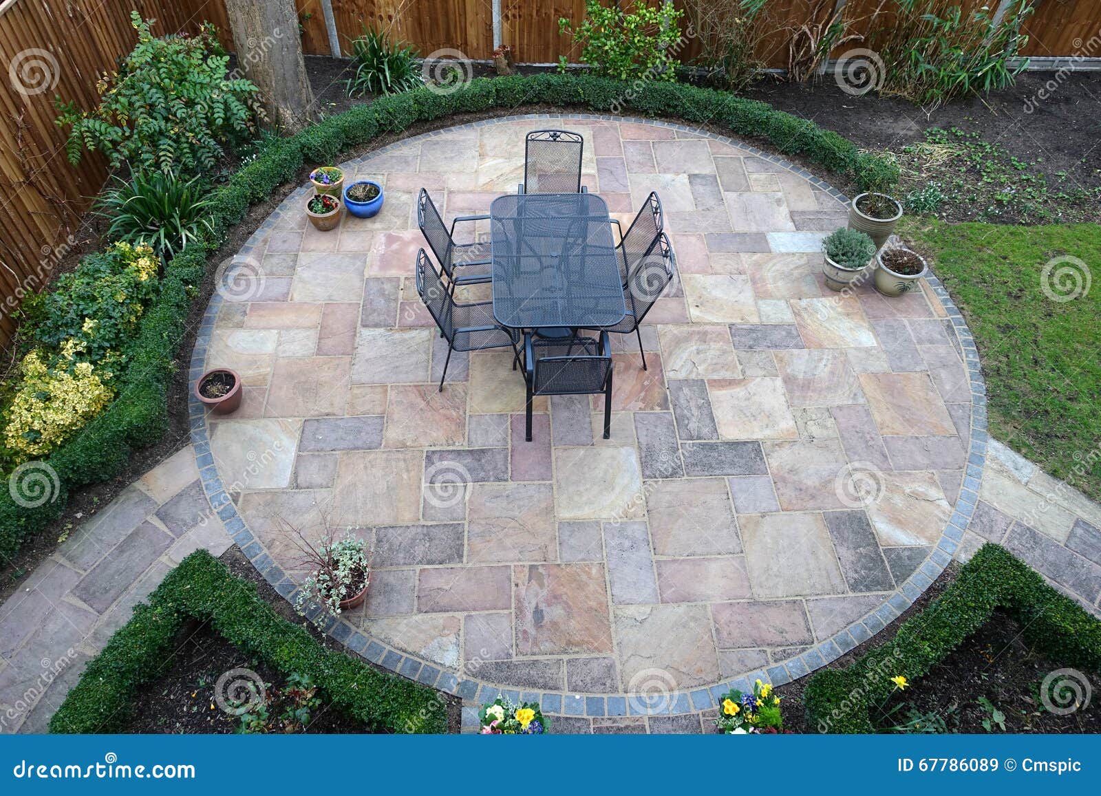 Round garden patio stock image. Image of planters, fence - 67786089