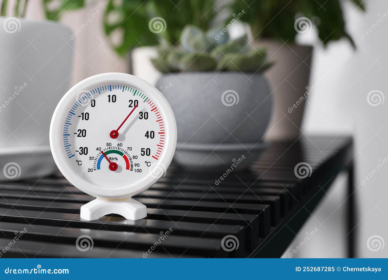 https://thumbs.dreamstime.com/z/round-mechanical-hygrometer-black-table-indoors-space-text-252687285.jpg