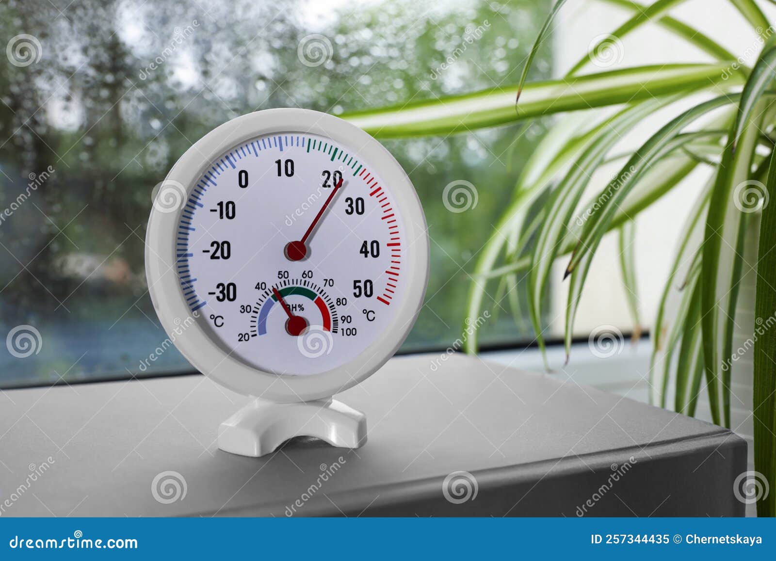 Round Mechanical Hygrometer on Book Near Window Stock Image Image of