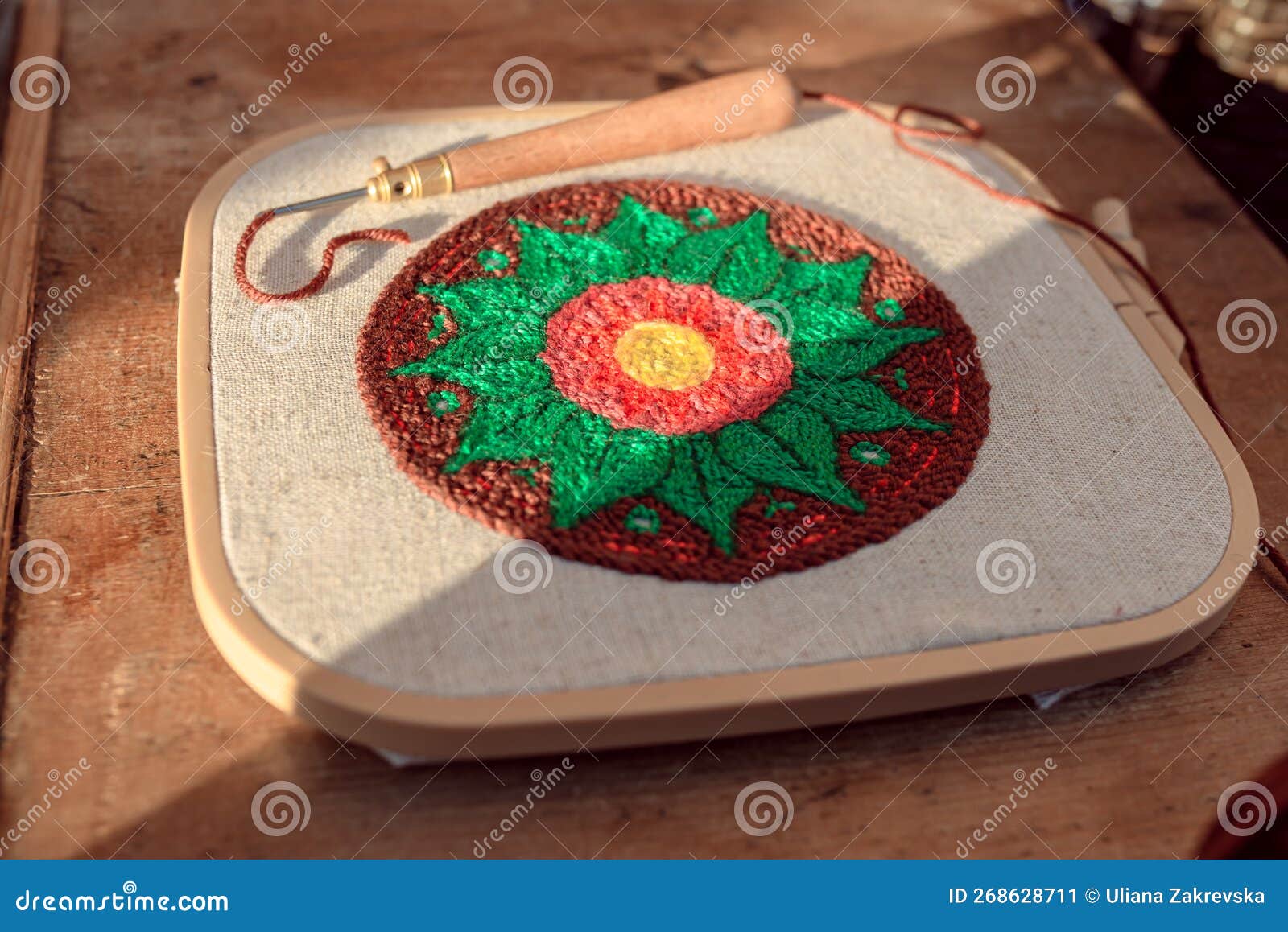 Round Needlework in a Square Hoop with a Threaded Punch Needle, Lying