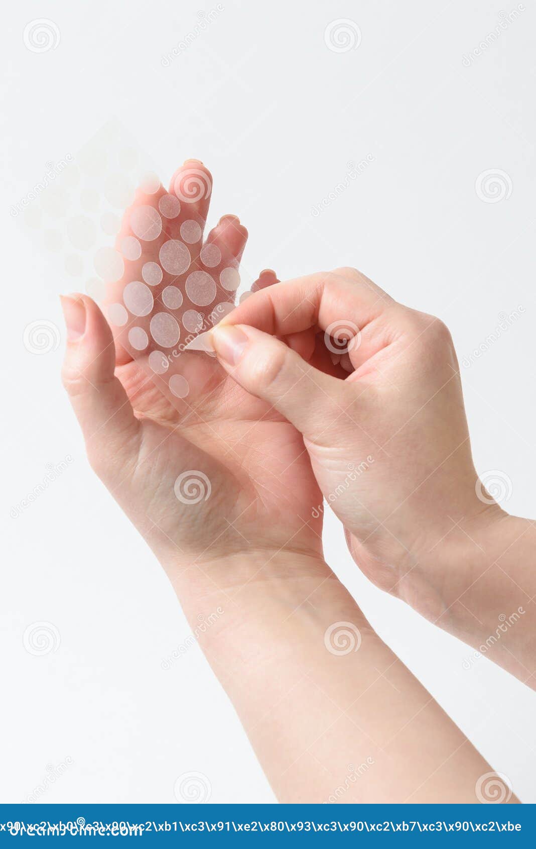 round patches for acne and wrinkles on the hands on a white background. acne and wrinkle patches for facial rejuvenation