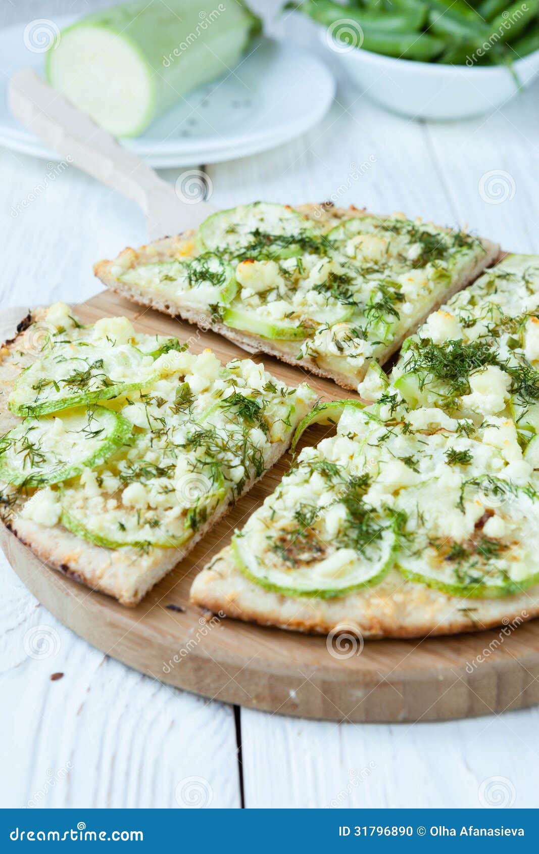 Round pizza with zucchini and cheese, food close up