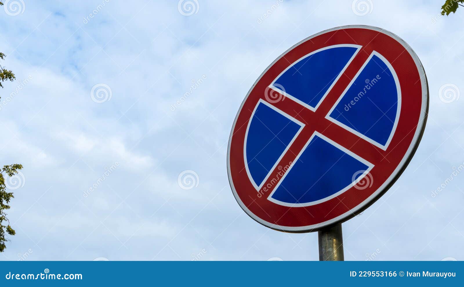 Round Road Sign with a Red Cross on a Blue Background. a Sign ...