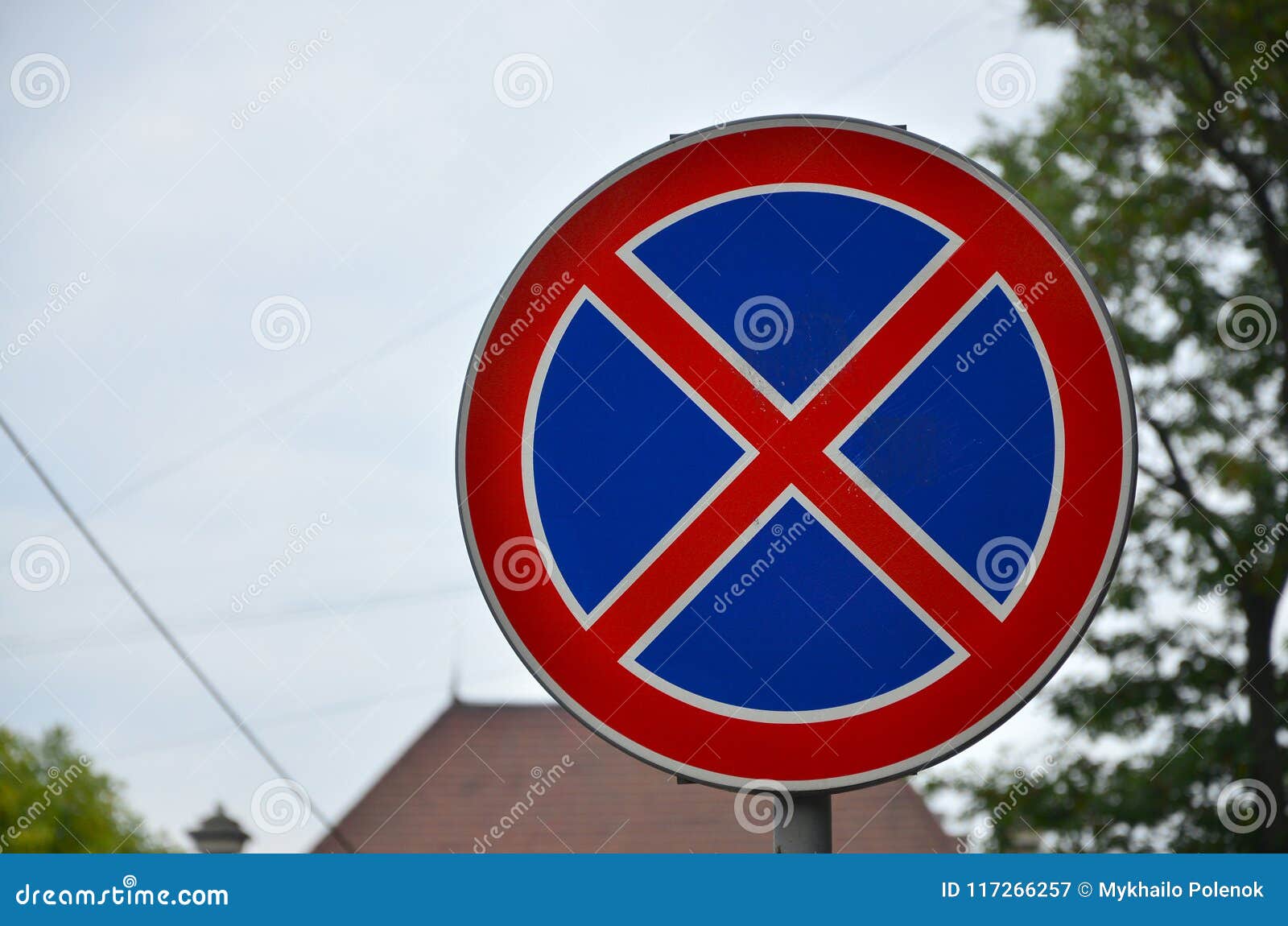 Round Road Sign with a Red Cross on a Blue Background. a Sign ...