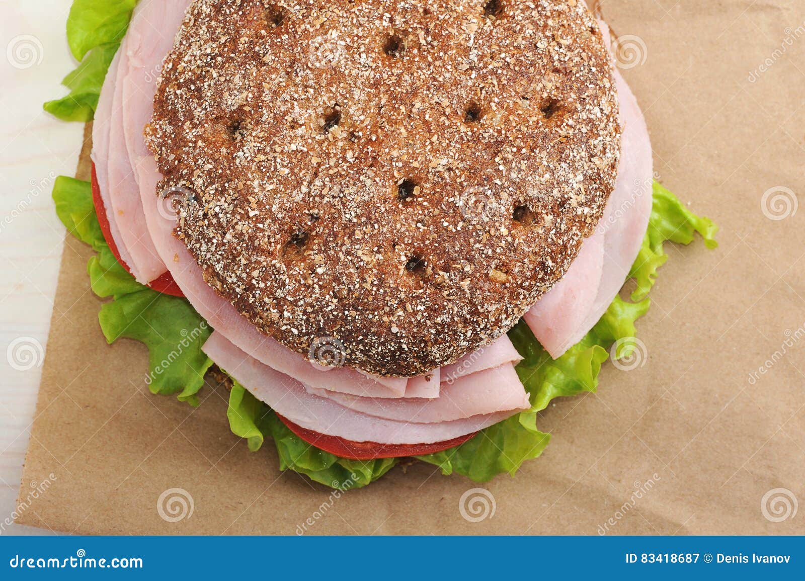 Round Sandwich of Rye Bread with Ham, Tomato and Lettuce Stock Image