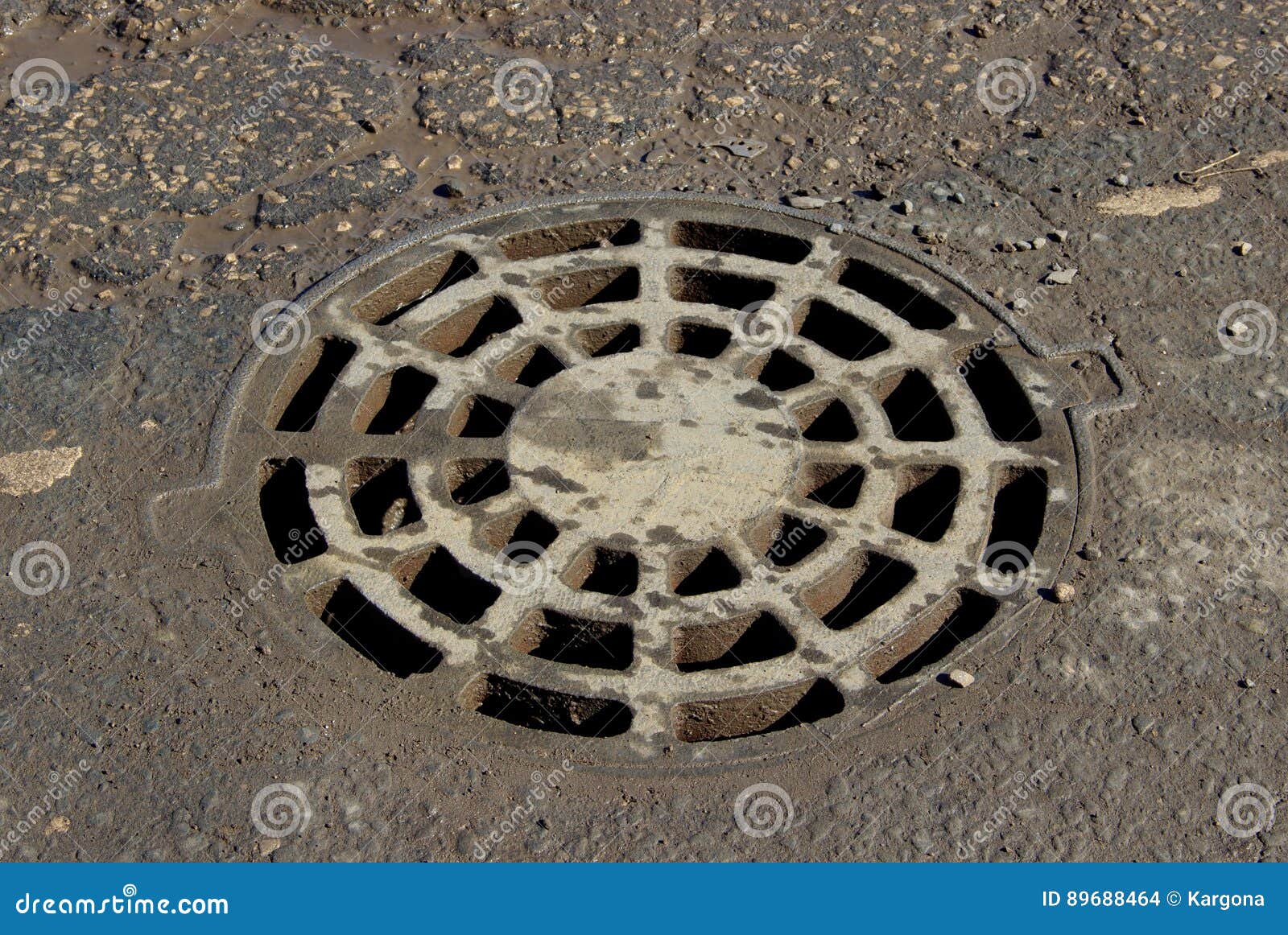 Round Storm Drain Grate Over Just Repaired Manhole On The Road Royalty