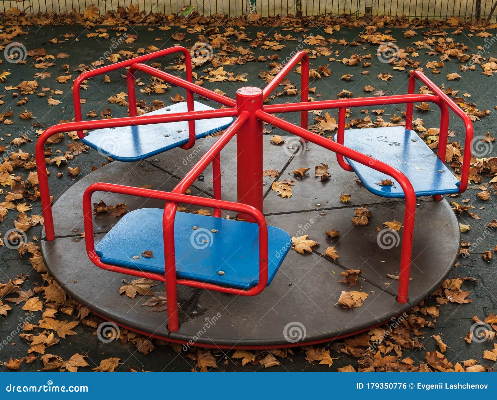 Round Swing in the Playground Covered with Yellow Leaves Stock Photo -  Image of circle, happiness: 179350776