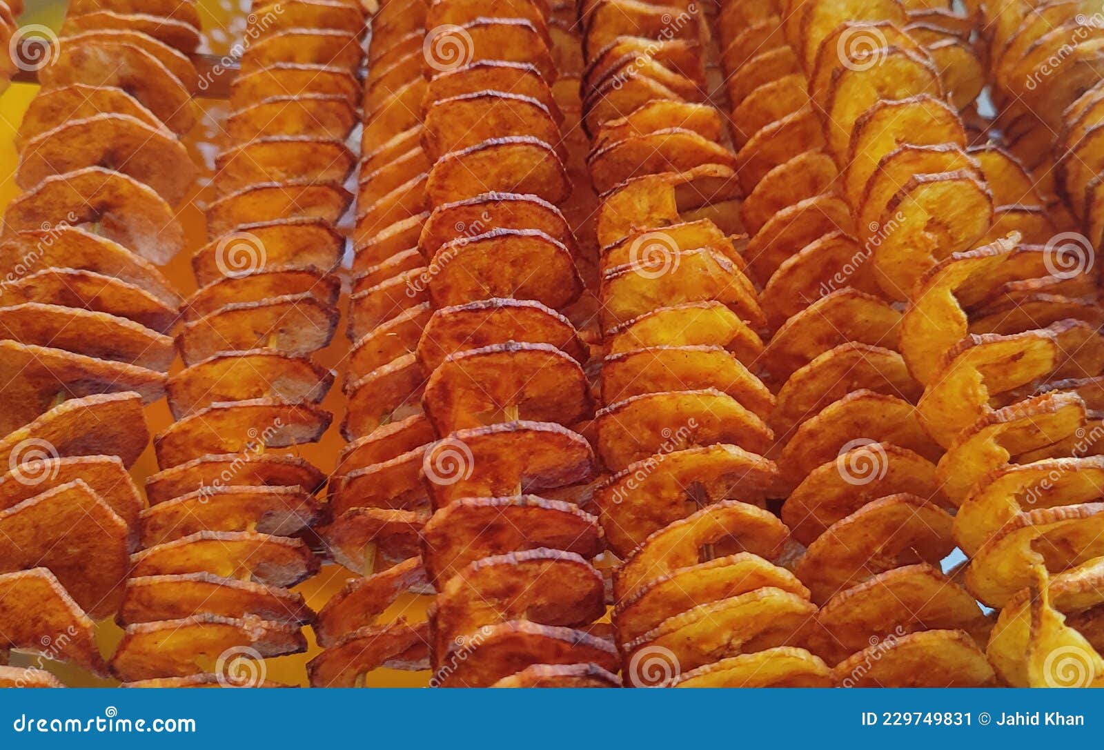 Round Twisted Potato Fry with Stick. Crispy Potato Fry Stock Image