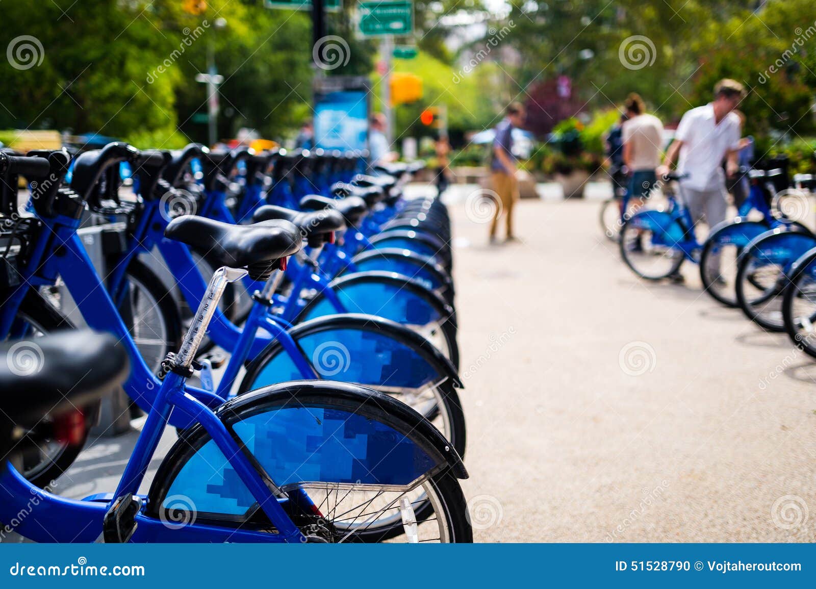 Row of Bikes To Rent in the City Stock Photo Image of blue, park