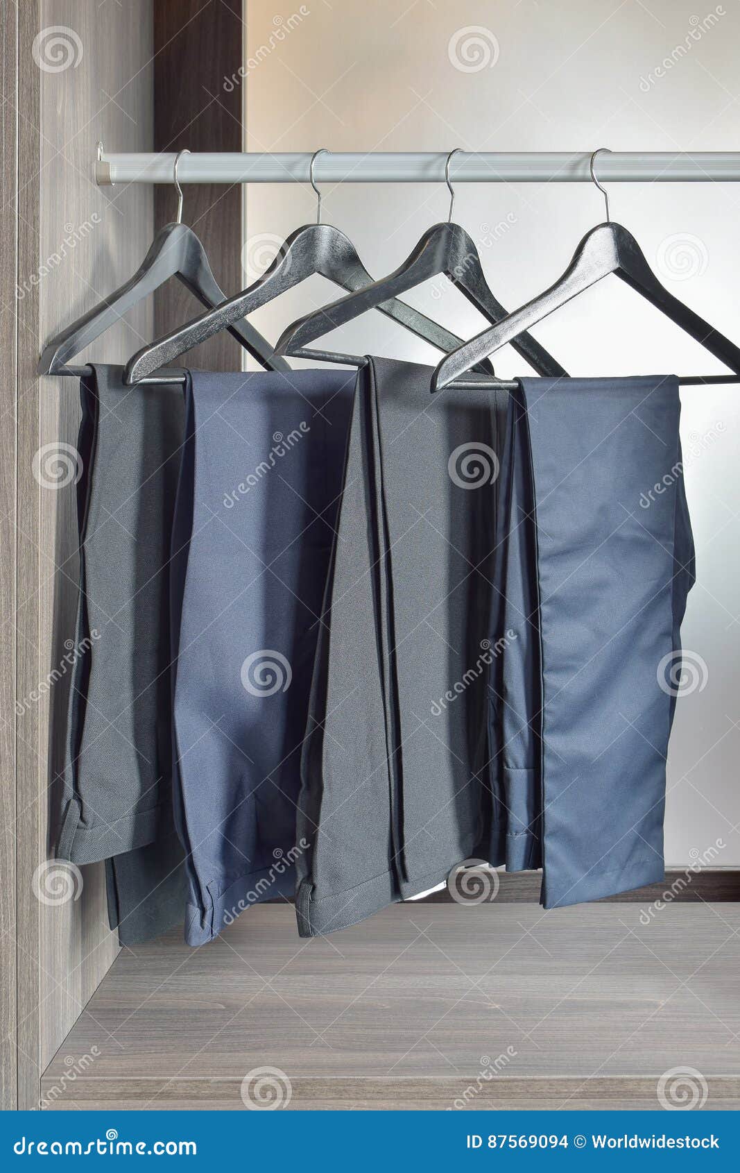 Row of Black Pants Hangs in Wardrobe at Home Stock Photo Image of fashion, sideways 87569094