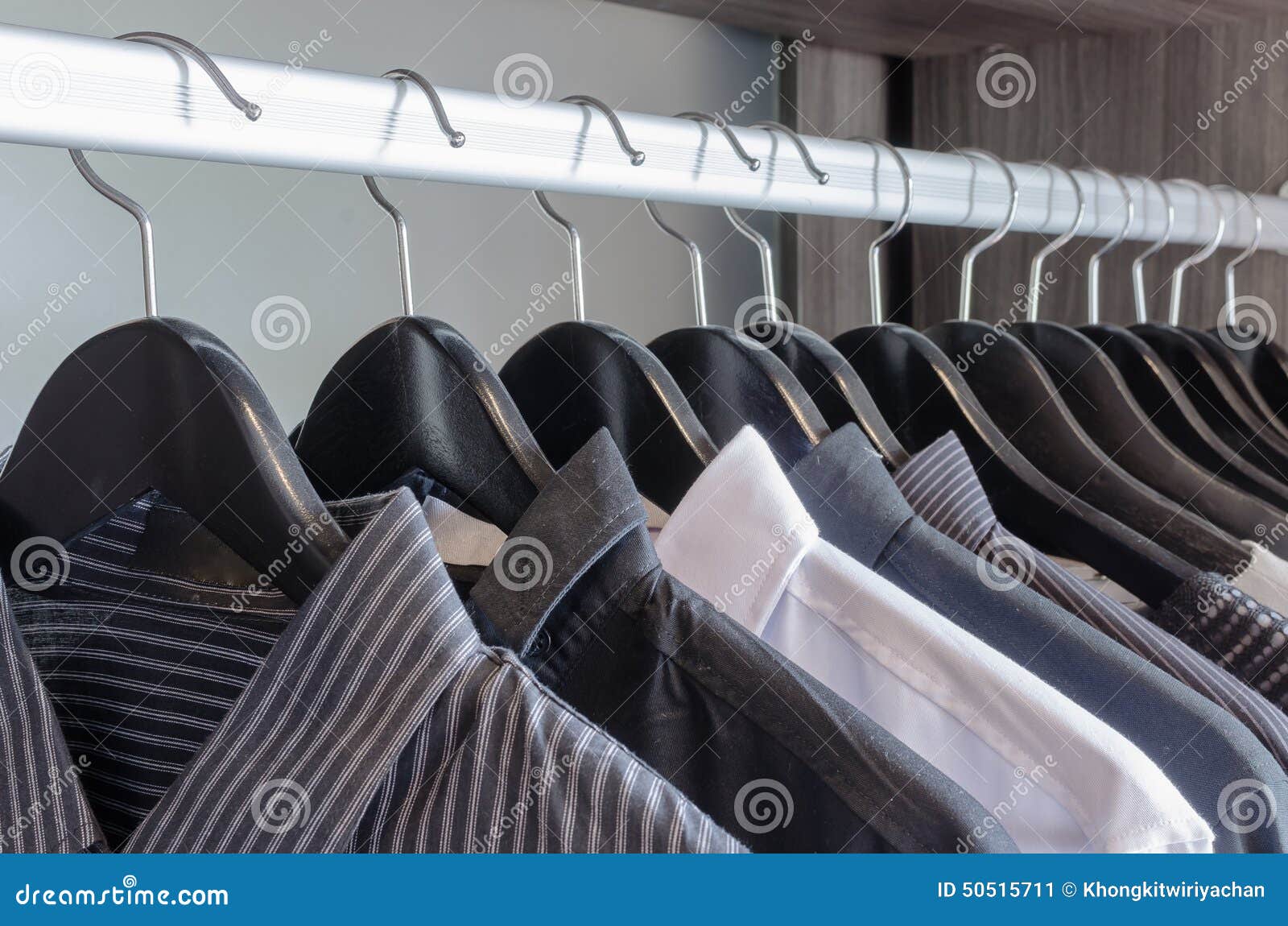 Row of Black and White Shirts Hanging Stock Image - Image of wear, wood ...