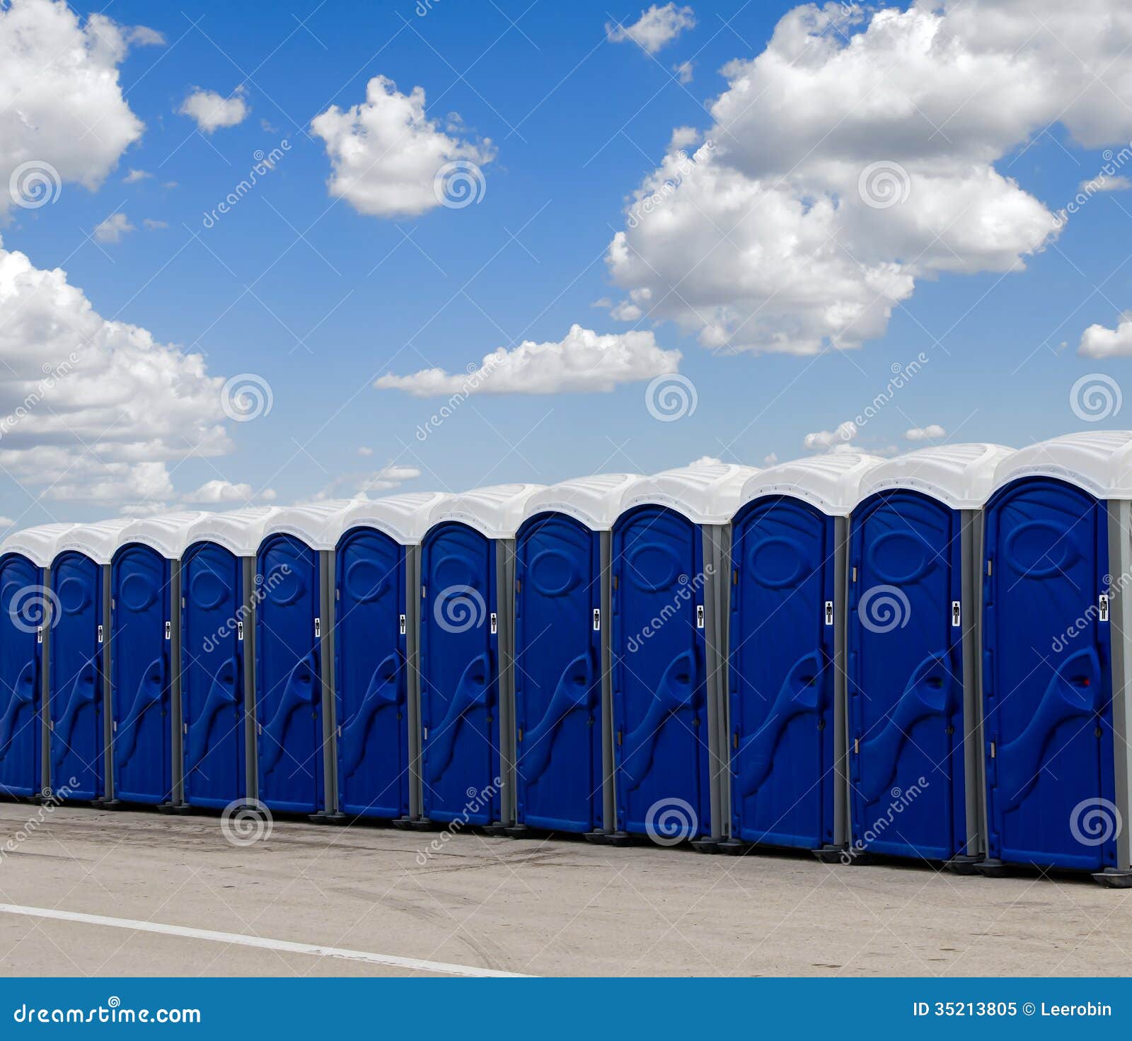 a row of blue portable toilets