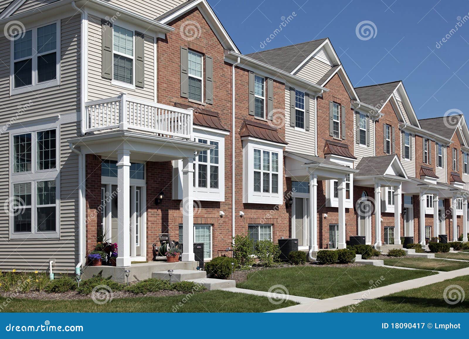 Row of brick townhouses stock image. Image of construction 18090417
