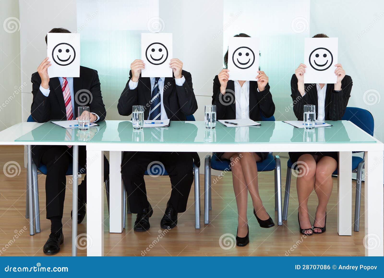 row of business executives with smiley faces