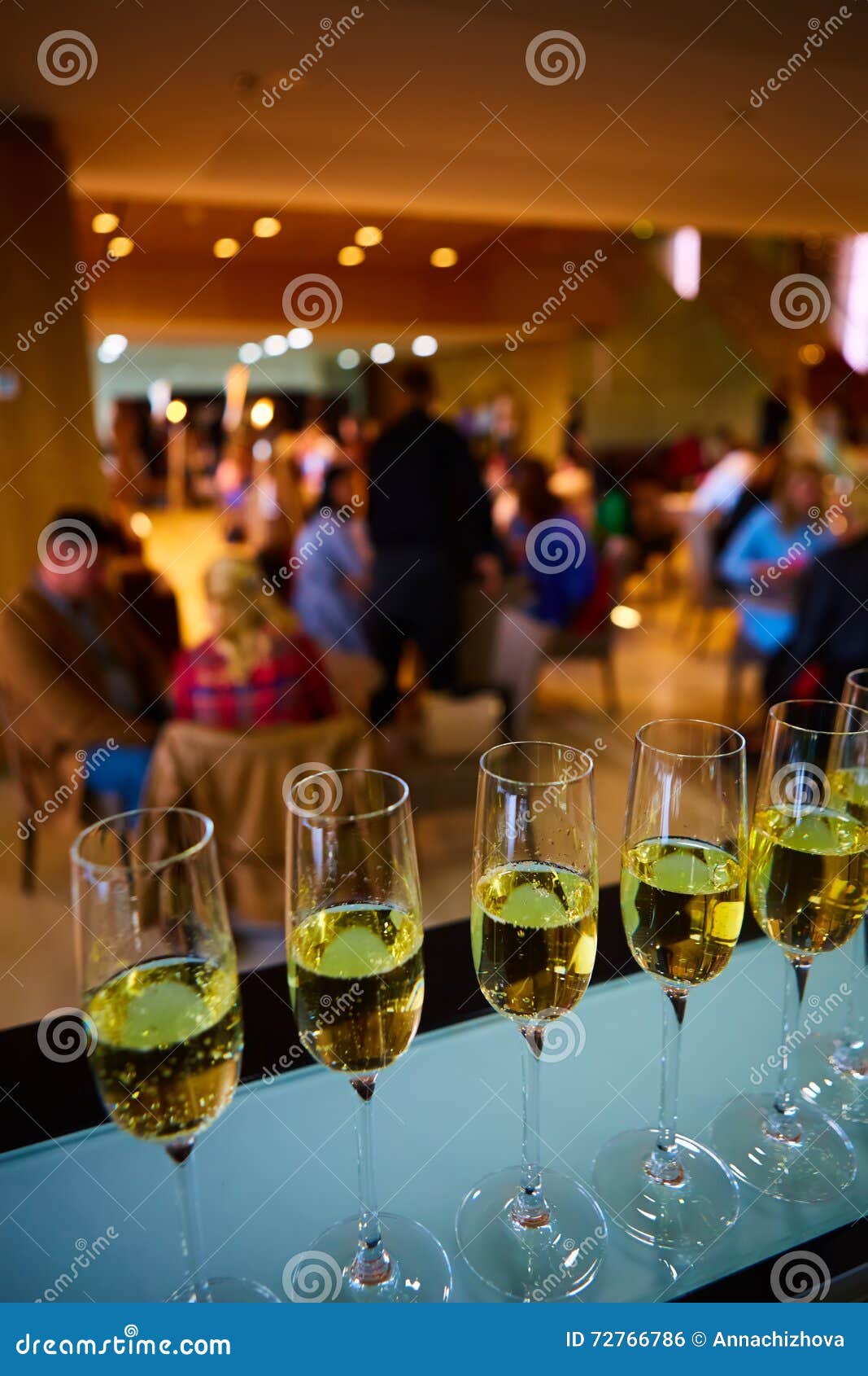 Row of champagne glasses stock photo. Image of drink 72766786