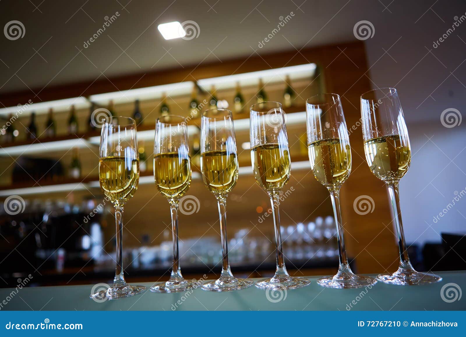 Row of champagne glasses stock photo. Image of drink 72767210