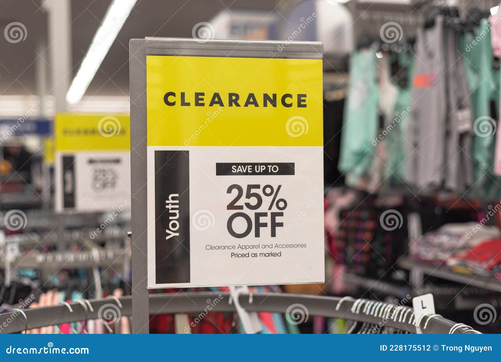 Row of Clearance Sign for 25 Percent Off with Blurry Modern Women