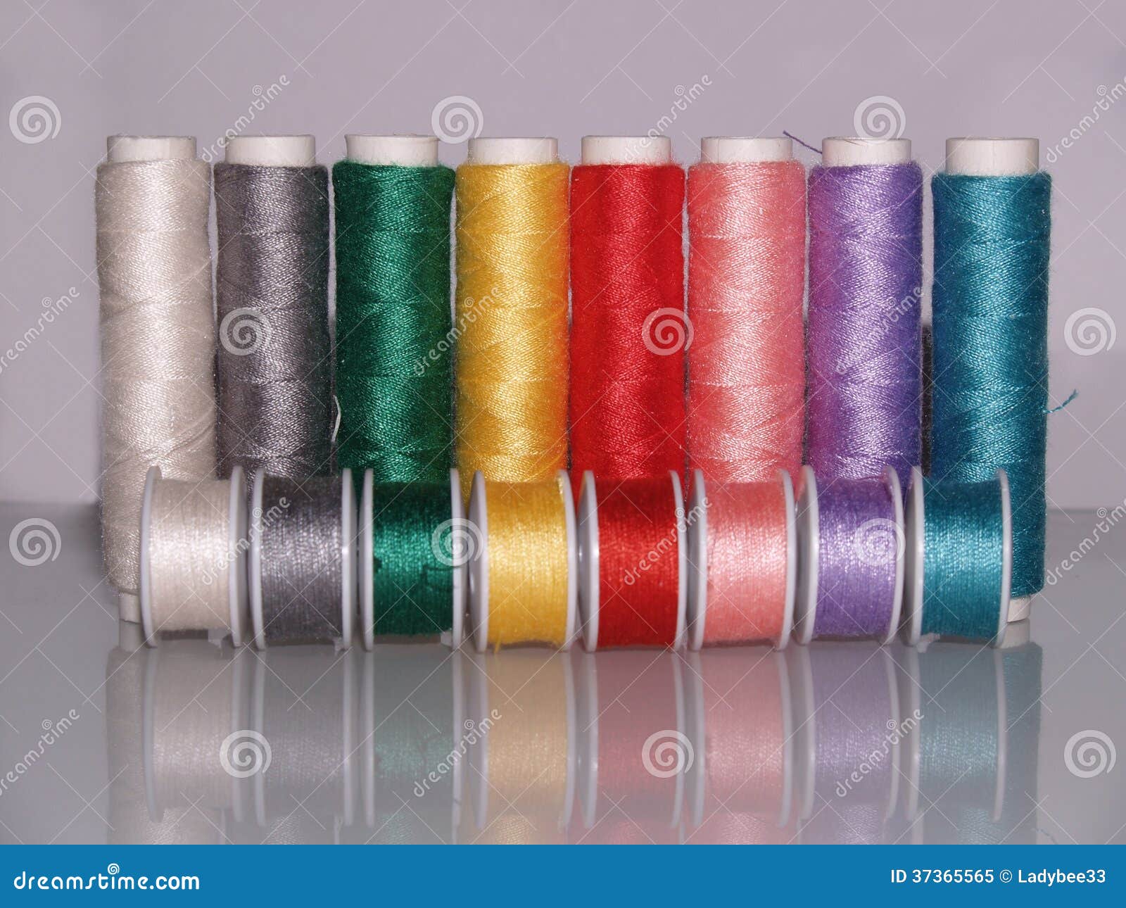 Row of Colourful Sewing Threads with Bobbins Stock Image - Image of bright,  bobbins: 37365565