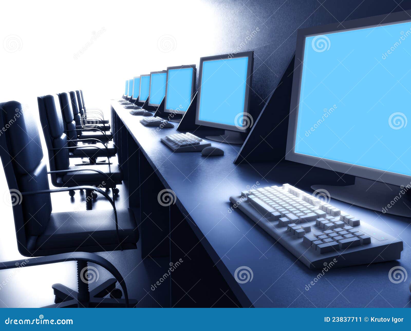 row of computers on desk