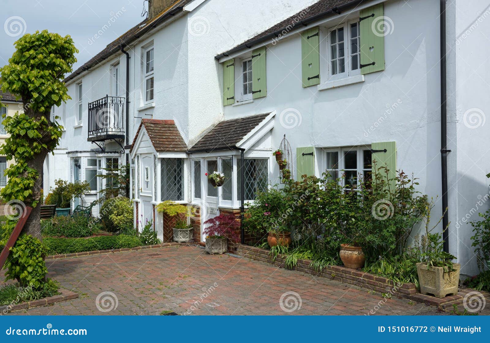 White painted cottages stock photo. Image of plants 151016772
