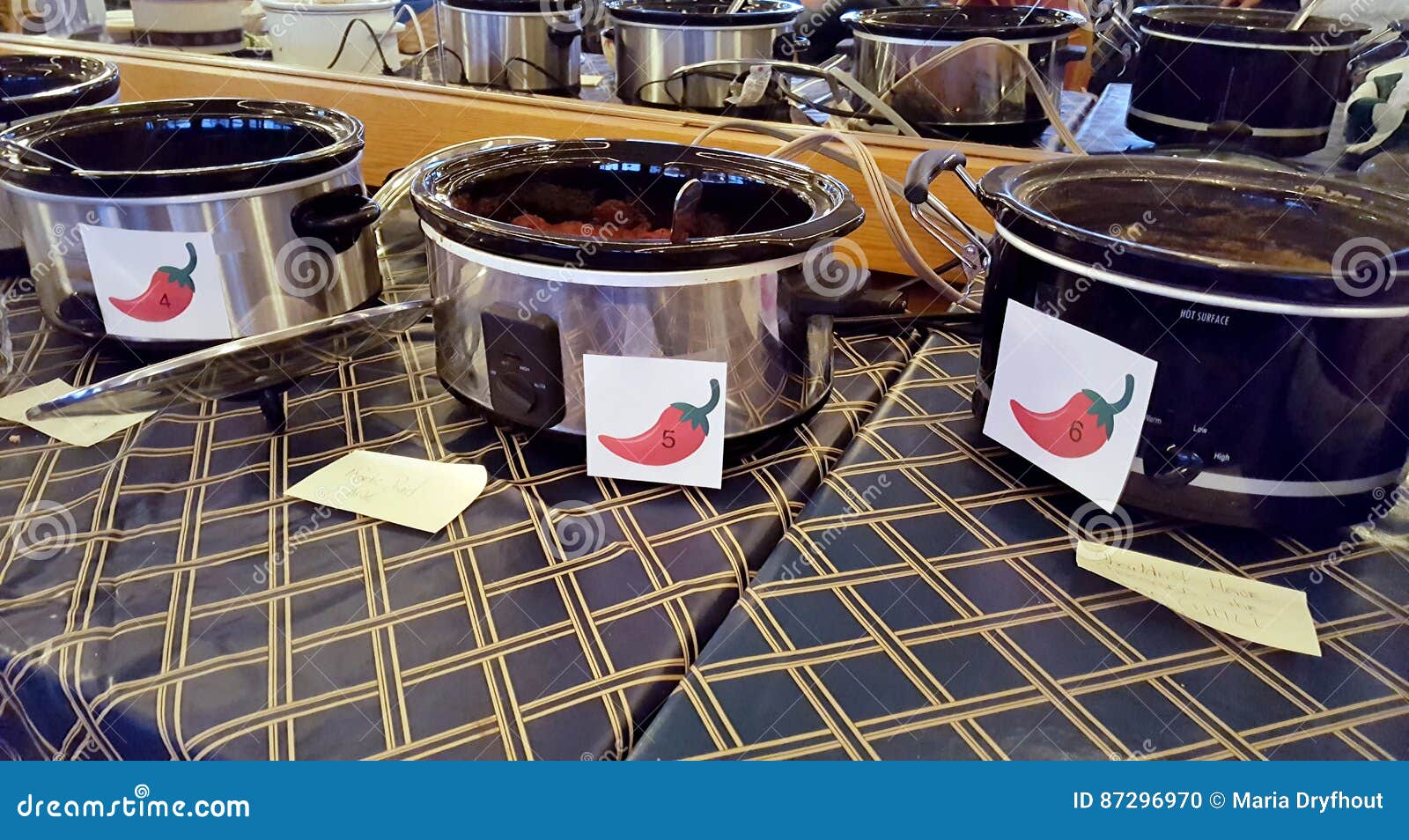 row of crock pots in chili cook-off contest