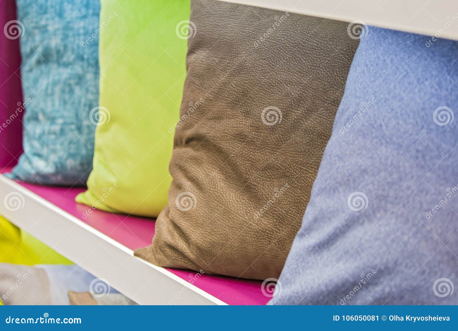 Row of Decorative Pillows on a Store Shelf. Leather Pillow Stock Image
