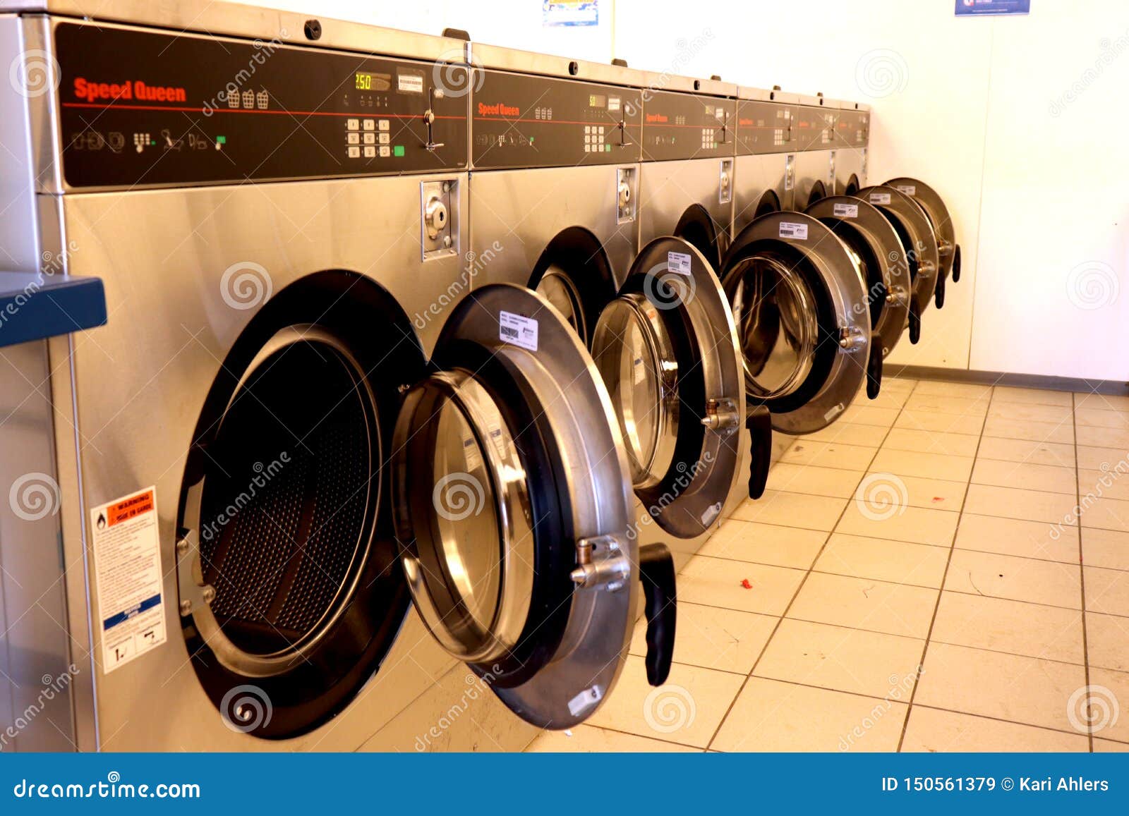 Front Load Washing Machines in a Laundromat Editorial Stock Image