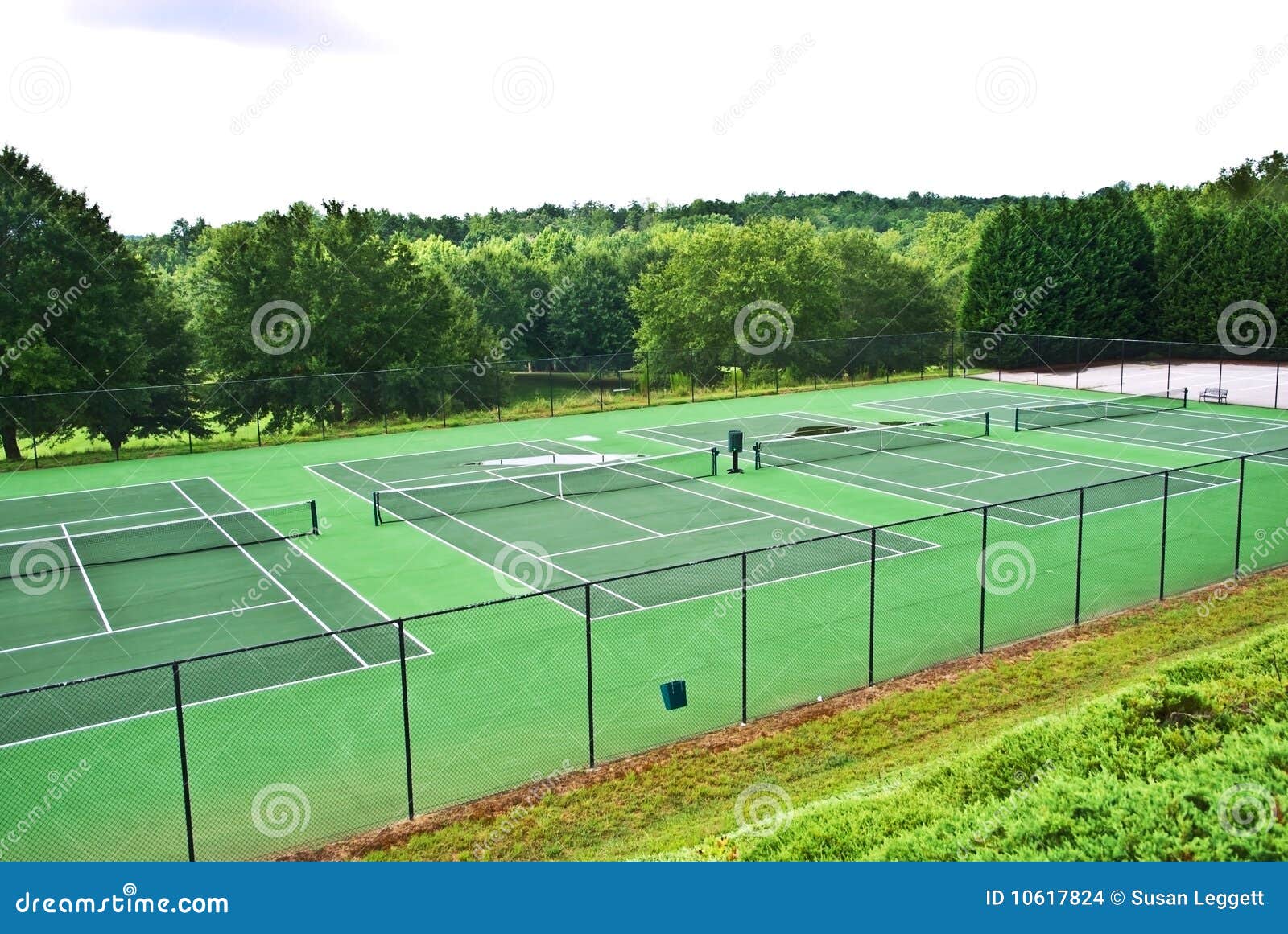 a row of empty tennis courts