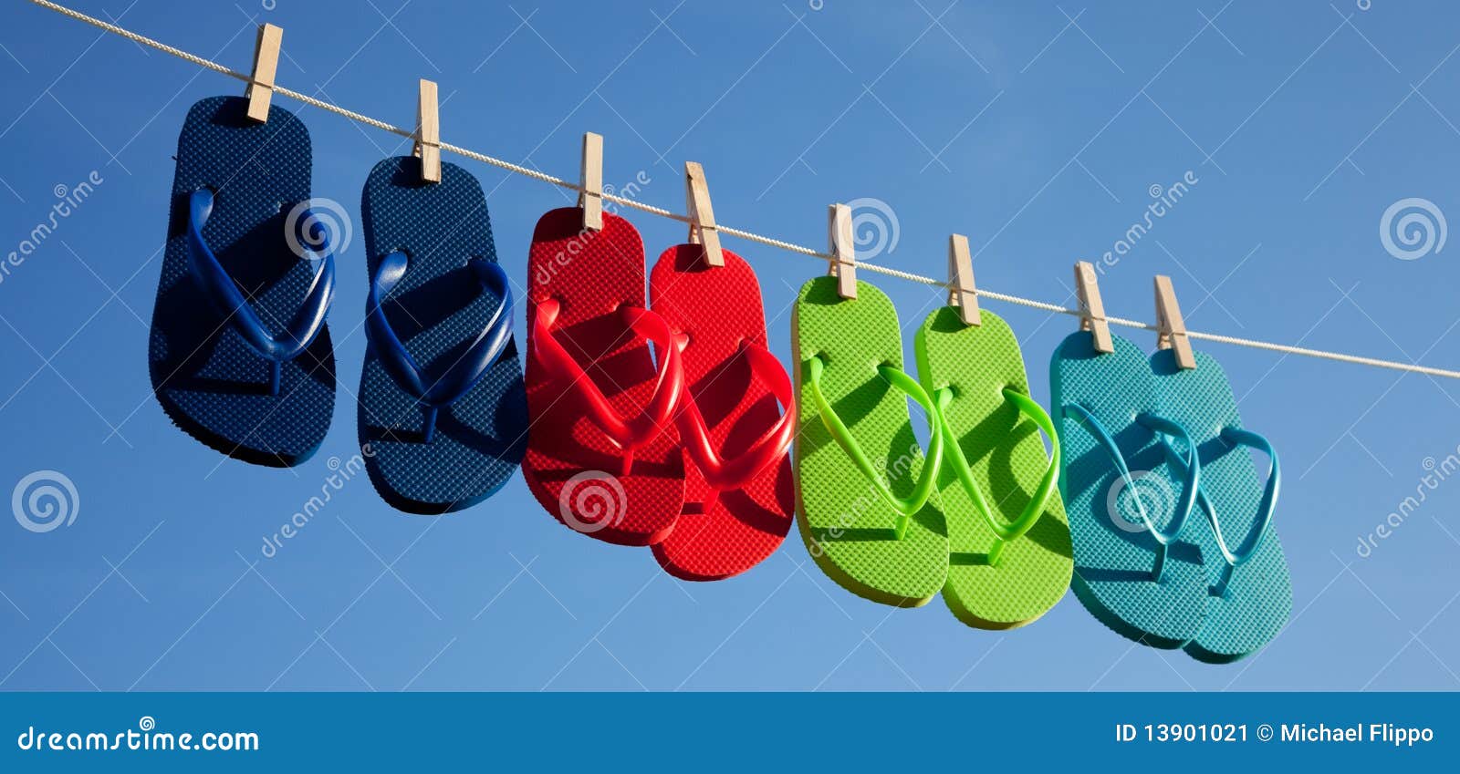 Row of Flipflops Against a Blue Sky Stock Image - Image of flop