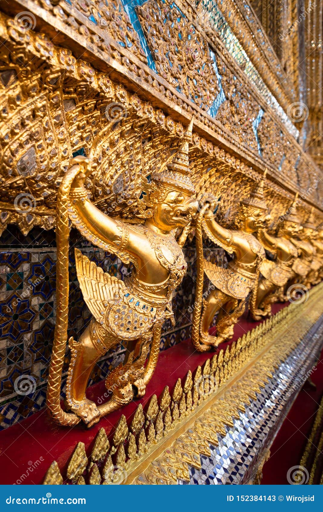 row of golden garuda scuplture wat phra kaew or the temple of the emerald buddha