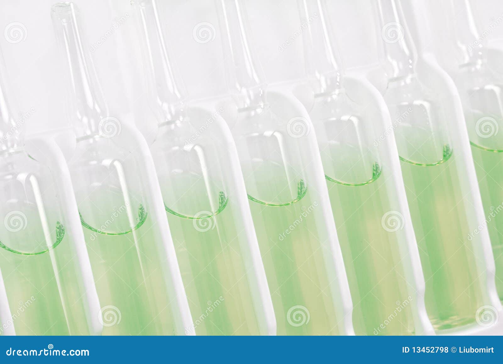 Row of green ampoules stock photo. Image of liquid, closeup 13452798